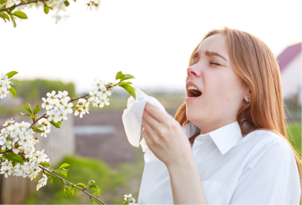 Woman that is about to sneeze.